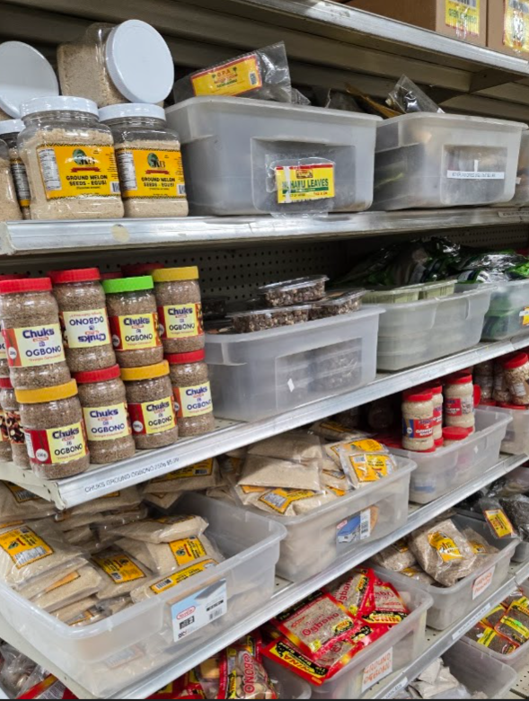 Shelves of ground egusi, ogbono and dried African spices in bulk containers