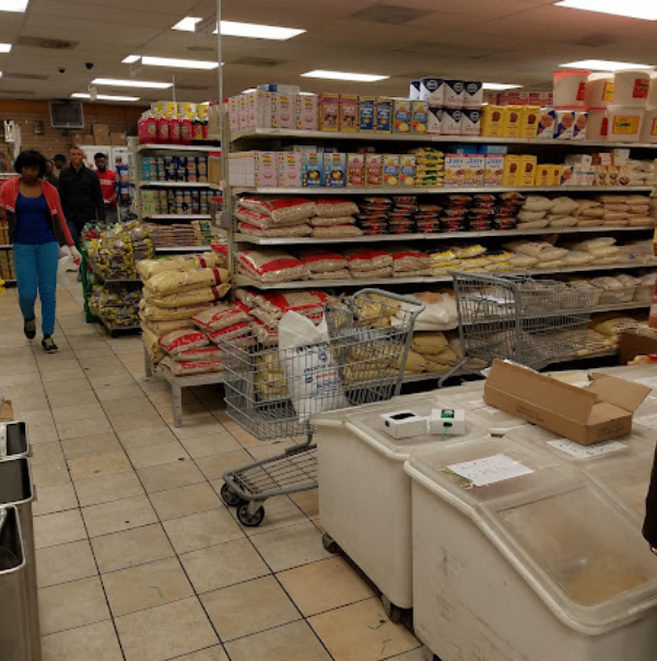 Wide aisle with bulk rice, grains and staple foods on pallets